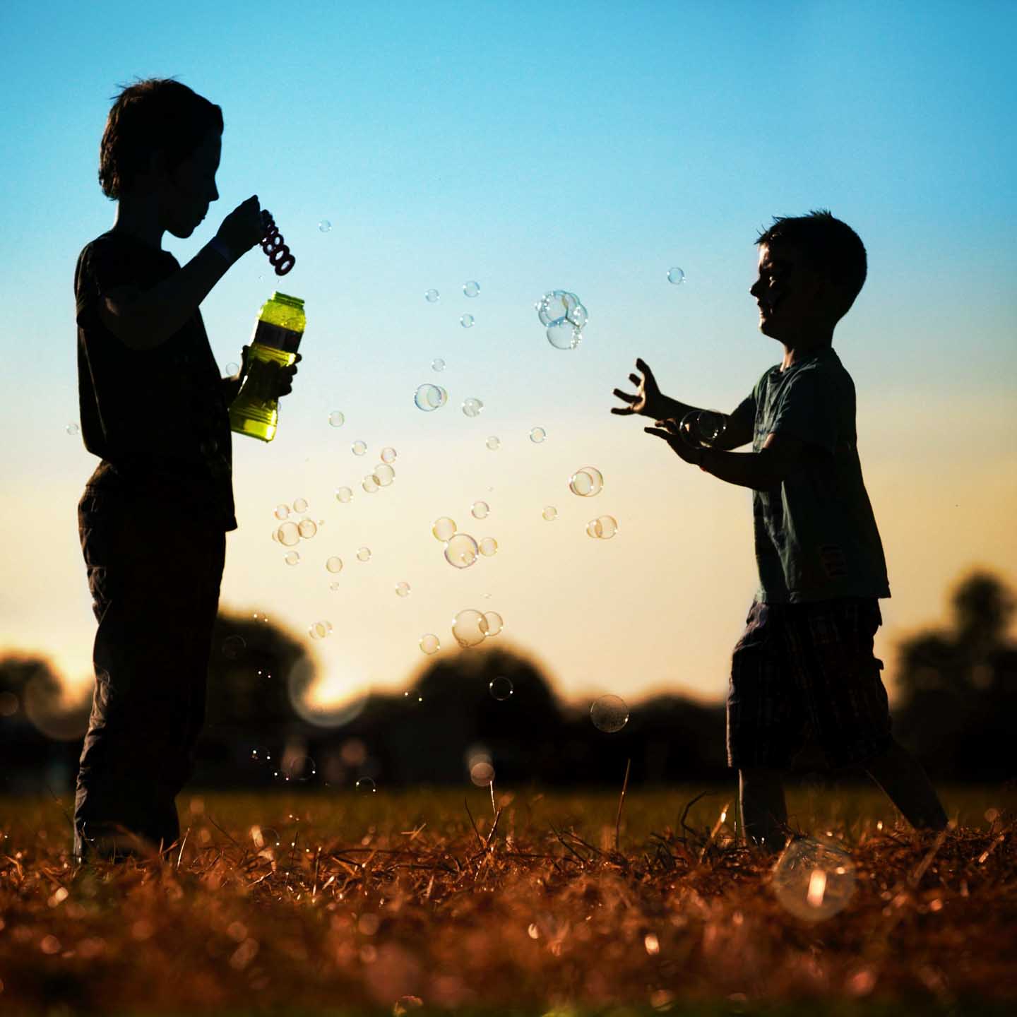 CJPOTY July 2023 shortlisted image for the Summer theme - blowing bubbles at sunset
